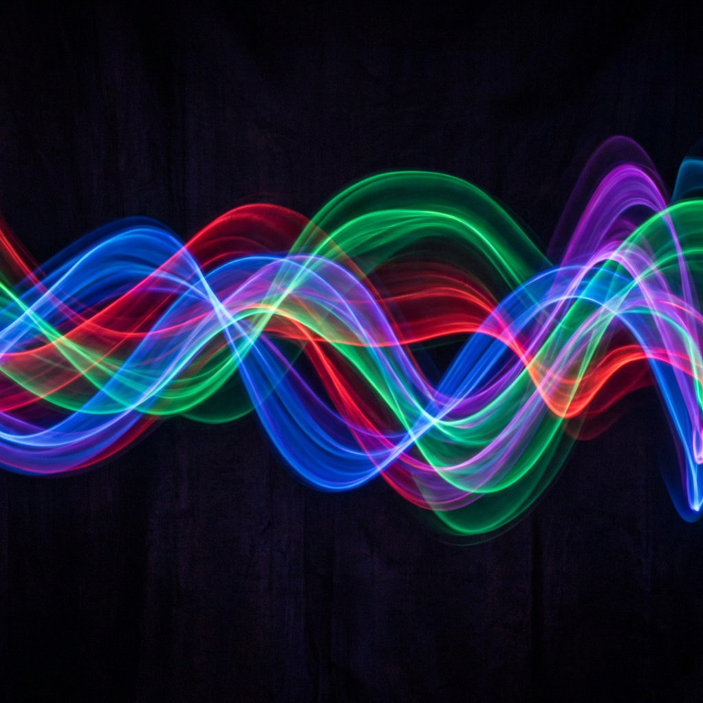 Abstract colorful sound waves on dark background